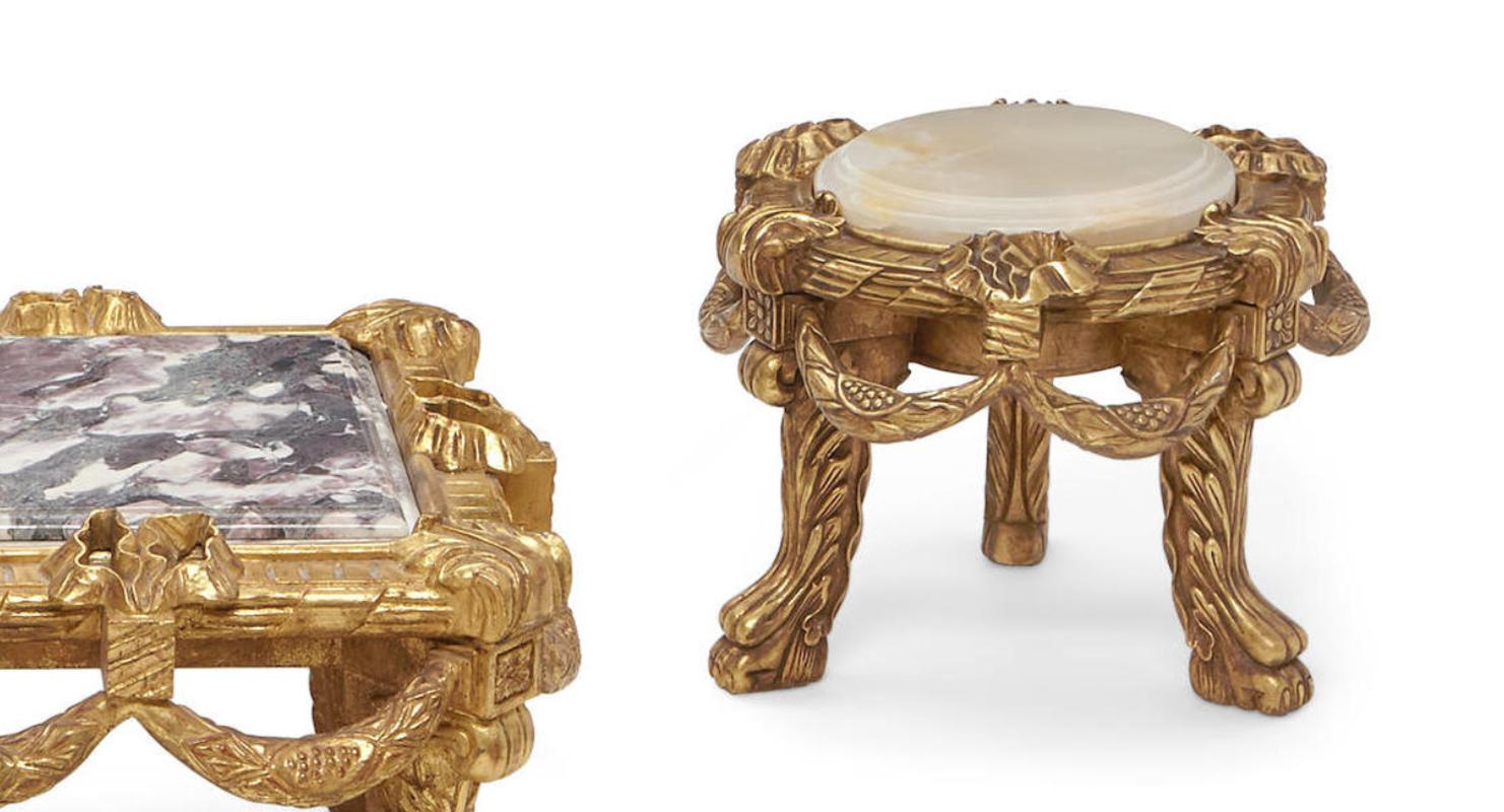 Outstanding Italian suite of five 22-karat gold leaf and carved giltwood low tables with marble tops. 
Second half of the 20th century.

The beautiful moulded and thick Brèche Violette marble tops are inset into finely carved giltwood with a