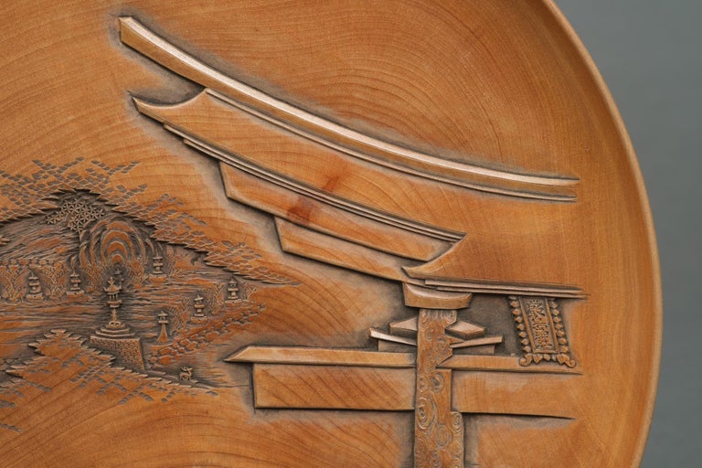 Set of five Japanese plates with carvings of the Itsukushima Shrine by