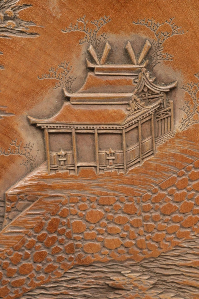 Set of five Japanese plates with carvings of the Itsukushima Shrine by