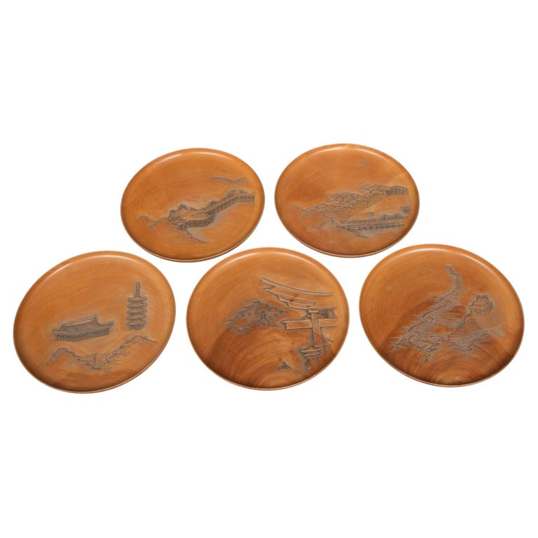 Set of five Japanese plates with carvings of the Itsukushima Shrine by