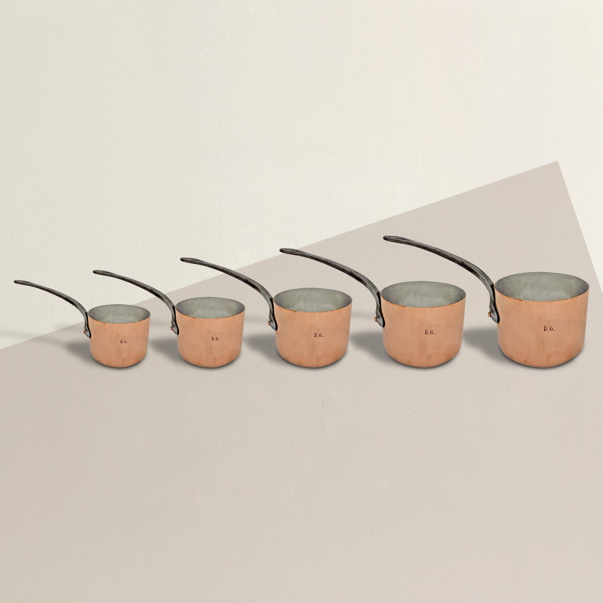 A set of five late 19th century French hand-hammered copper saucepans, ranging in sizes from 4.5 to 9.5 quarts, and all newly re-tinned so they’re ready for another hundred years of use.  Based on their sizes, this set was probably used in the
