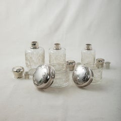 Set of Five Late 19th Century French Vanity Crystal Bottles with Silver Lids