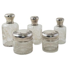Set of Five Late 19th Century French Vanity Crystal Bottles with Silver Lids