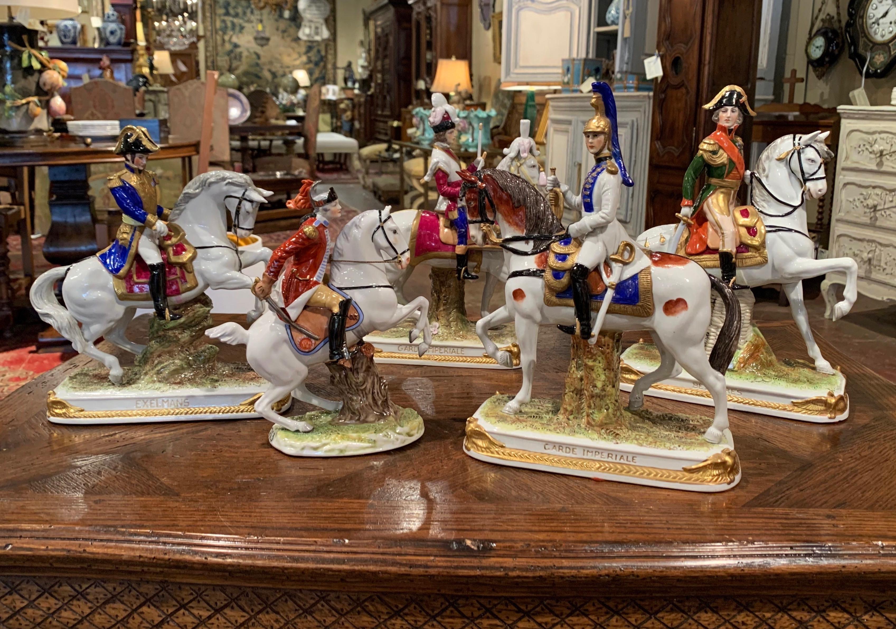 Decorate a shelf with this elegant set of porcelain horses and riders figurines. Crafted in Germany circa 1960, each hand painted colorful figure is marked with a crown and N mark (attributed to Potschappel, founded by Carl Thieme in 1872, Saxony,