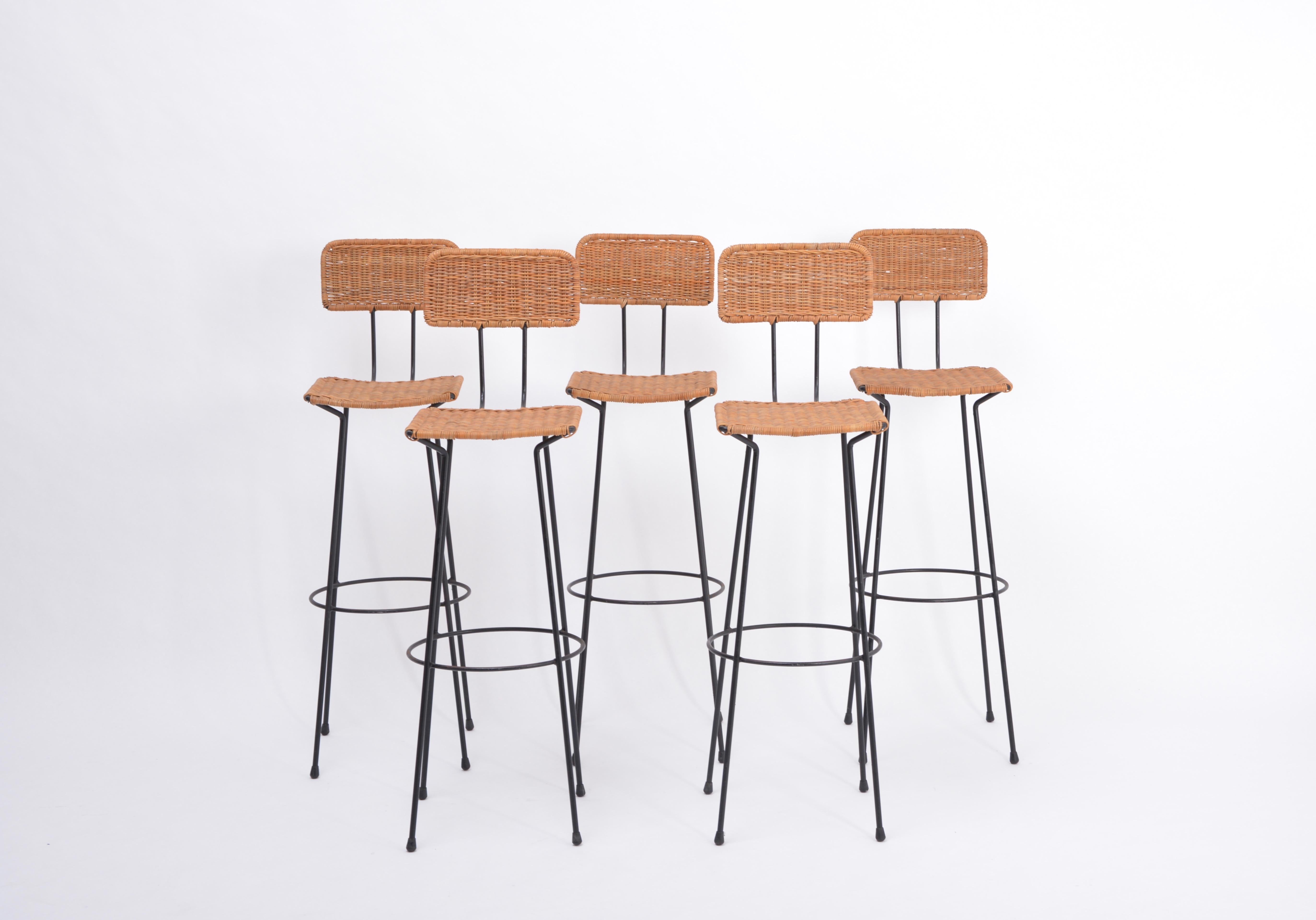 Rare set of five bar stools designed by Swiss architect Gian Franco Legler in 1951. The stools have solid metal black painted frames and handwoven cane seats and backs - very nicely manufactured. Absolutely beautiful design classics - with minor