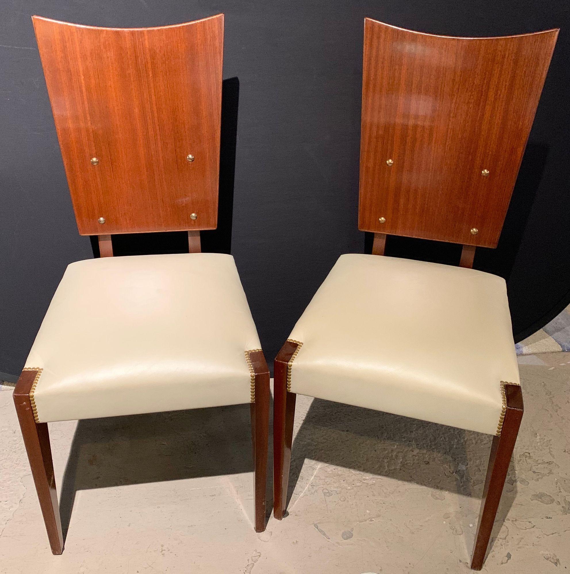 Set of Five French Andre Sornay Style Mid-Century Modern Dining / Side Chairs
 
Set of five Mid-Century Modern or Art Deco style shield back dining, office or side chairs. Each having a Macassar style high shine finish with button backs on padded