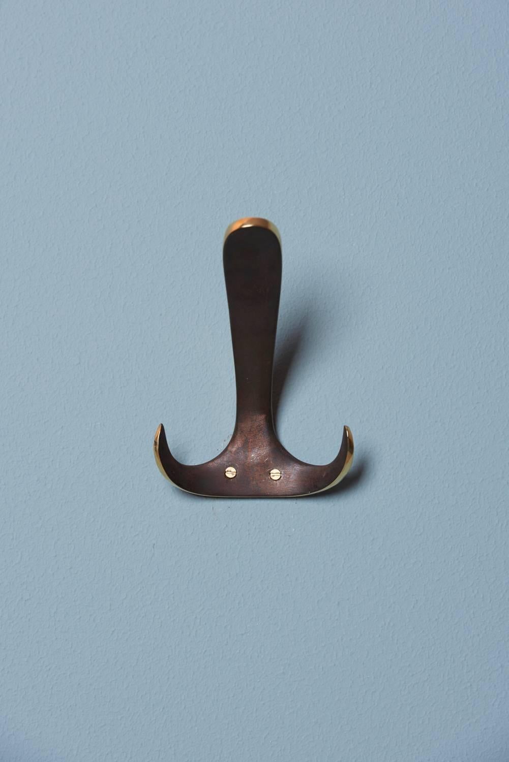 Set of five patinated #4982 wall hooks by Carl Auböck.

(Other quantity also available).

       