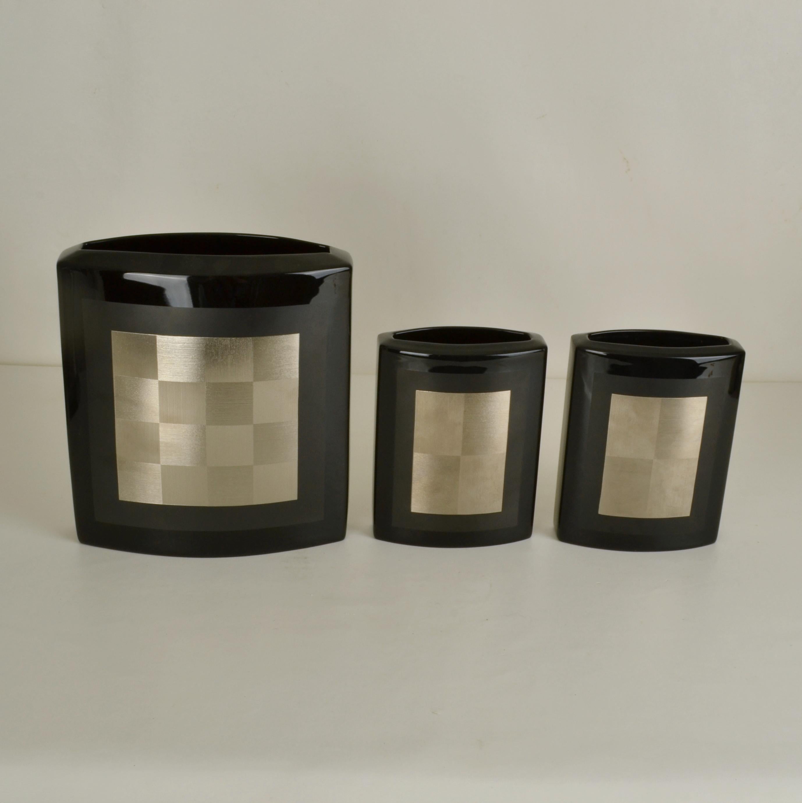 Set of five black Rosenthal porcelain vases marked Studio-line designed. Four are by Helmut Dresler (1927-2016), hand painted three in sliver geometric chequer design and one a V motif. One is by Elisa Fisher-Treyden (1901-1995). They all have a