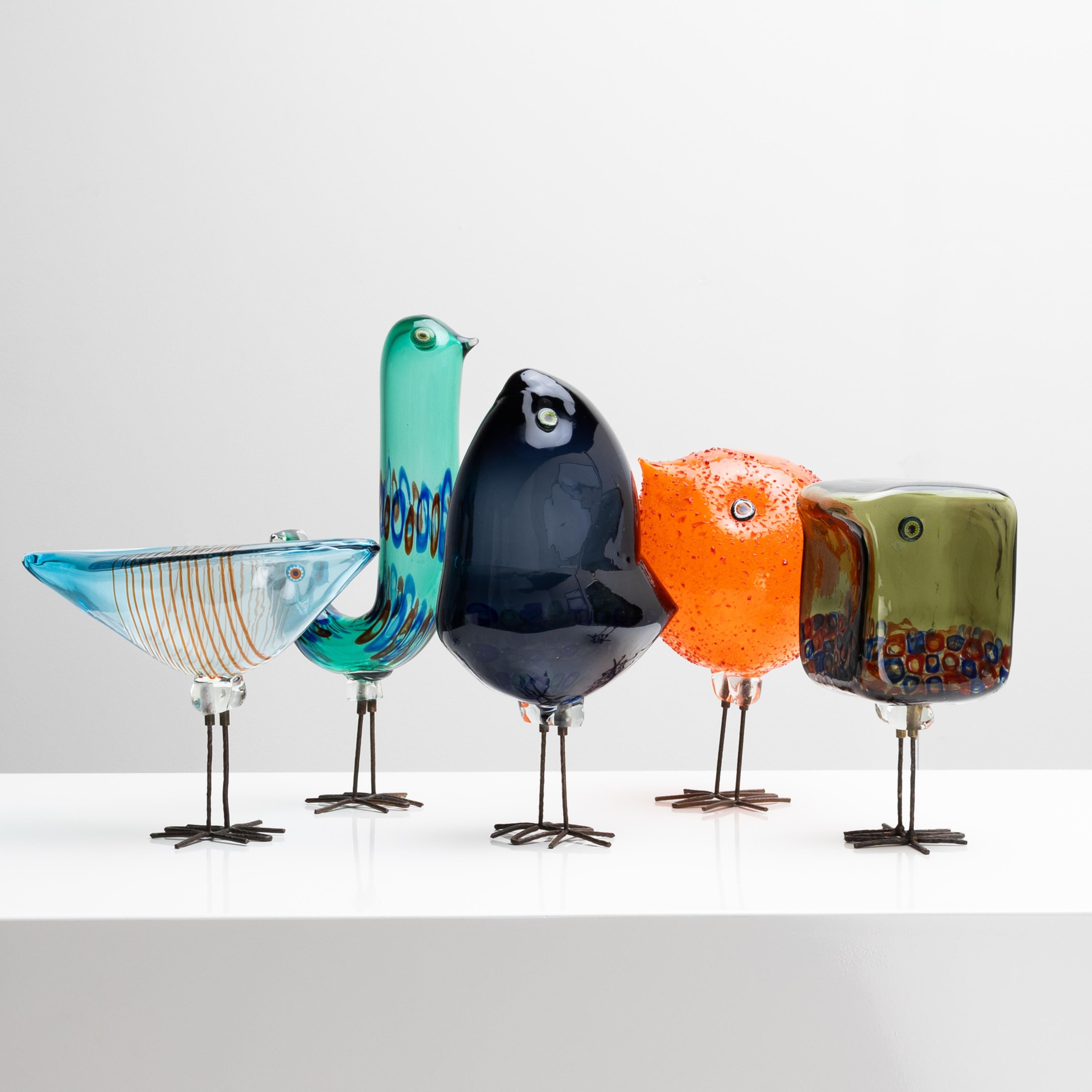 Rare set of five blown glass birds resting on their hammered copper legs.

These are the models designed by Alessandro Pianon for Vistosi in Murano, in 1962.

The first bird (far left) has a triangular shape. Its body is light blue colour and is