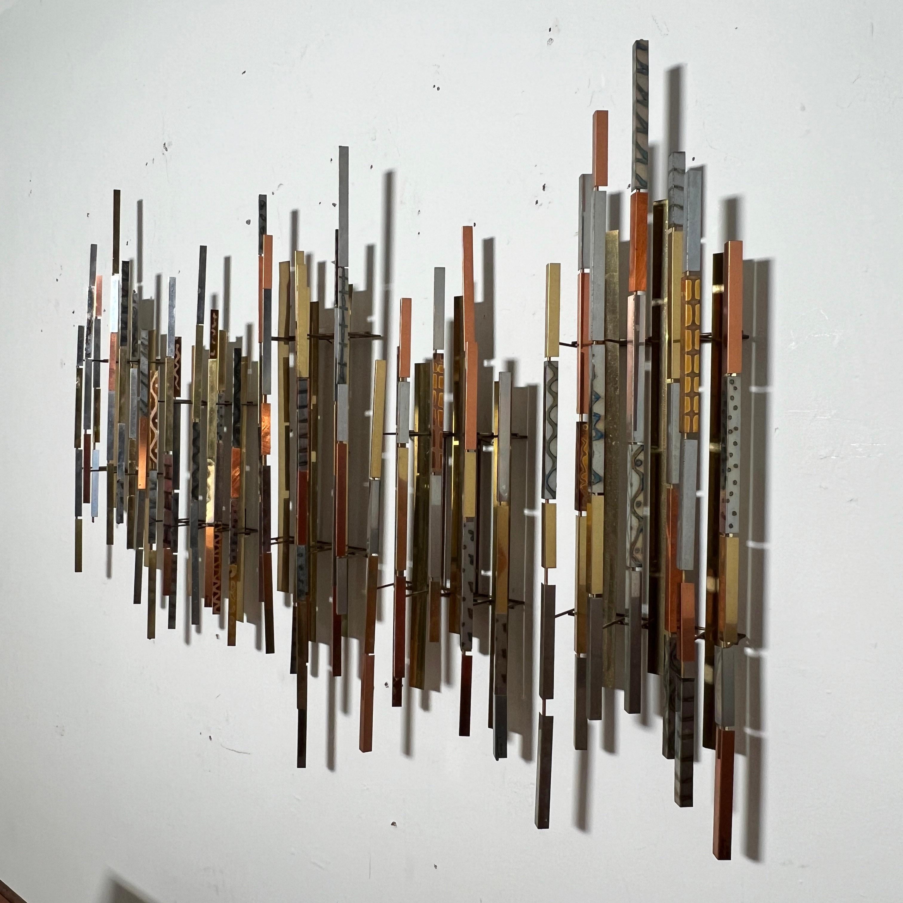 An assemblage of five architectural metalwork wall sculptures by the noted Baltimore, MD artist Raymond Herbert Berger (1929-2017). They can be arranged vertically (as shown) or horizontally to suit any wall space and each is signed individually and