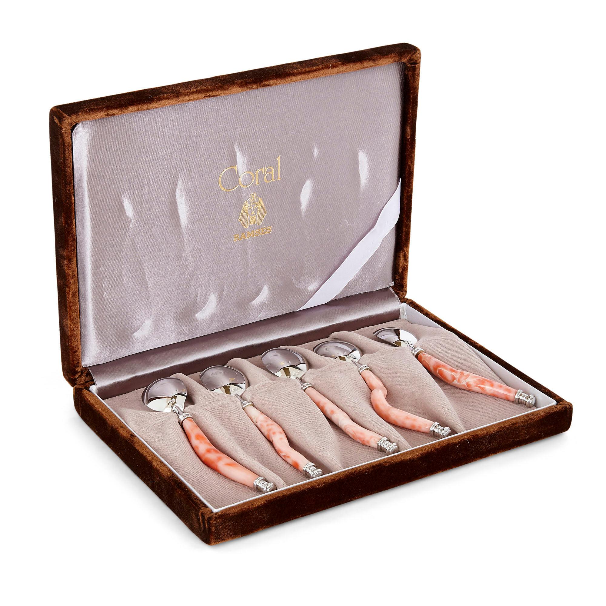 Set of five red coral and silver spoons
Chinese, 20th century
Measures: Spoon: Length 12cm, height 2cm
Box: Height 3cm, width 21cm, depth 15cm

The unusual caviar spoons in this set are crafted from coral and silver. Each spoon features a