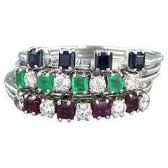 juego de cinco anillos oro 18k con zafiro, rubí, esmeralda y diamantes 0,50ct