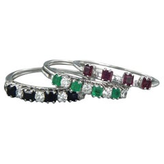 set of five rings 18k gold with sapphire, ruby, emerald and diamonds 0.50ct