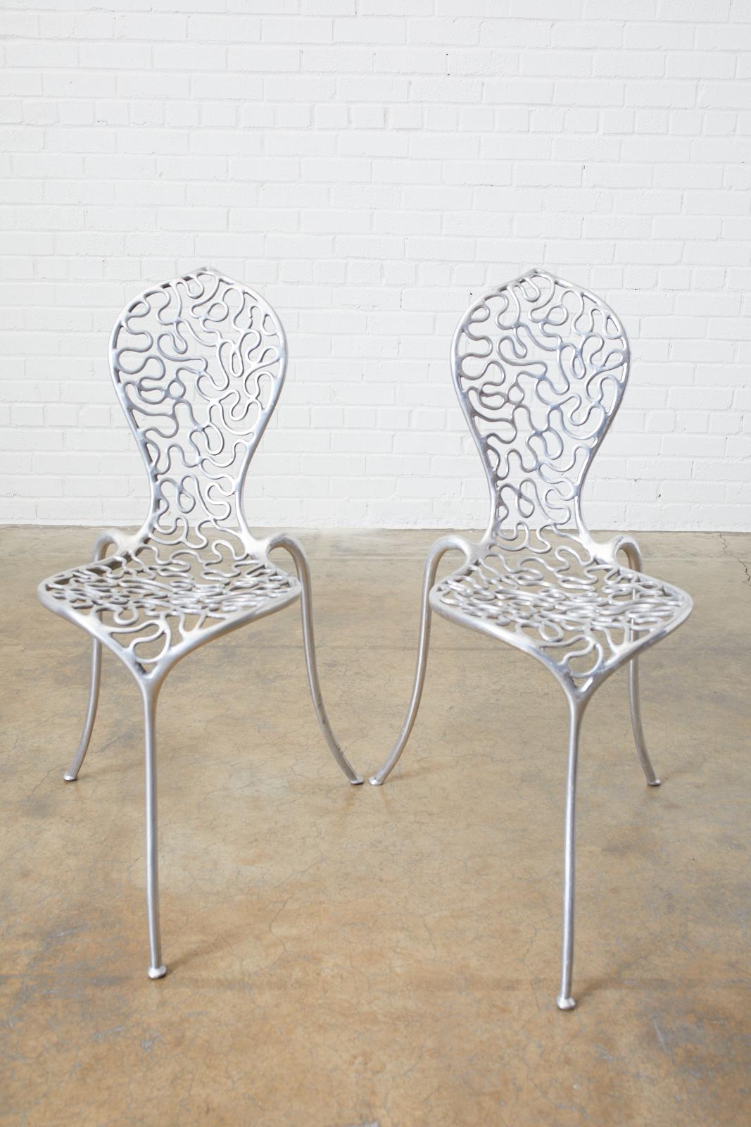 Rare set of five cast aluminum peanut chairs designed by Stephane Rondel (French). Rondel is a Parisian designer who now resides in New Zealand. These chairs were made in 1991 with a very limited production of 5,000 worldwide and many are on
