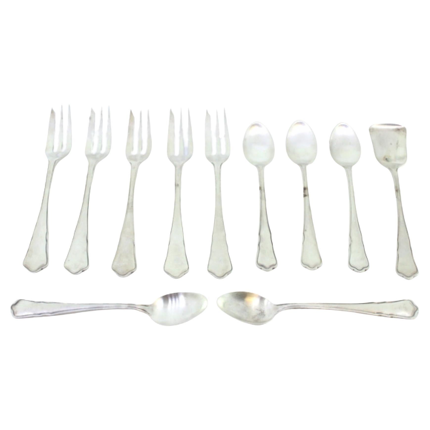 Set of five silver cake forks
teaspoons w/ sugar scoops w/ trim on the handles