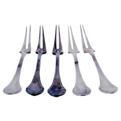 Set of five silver pickle forks with revealed handles