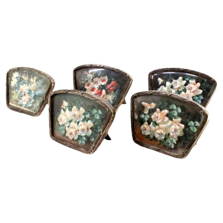 Set of five silver place markers with wraparound trim and support brackets