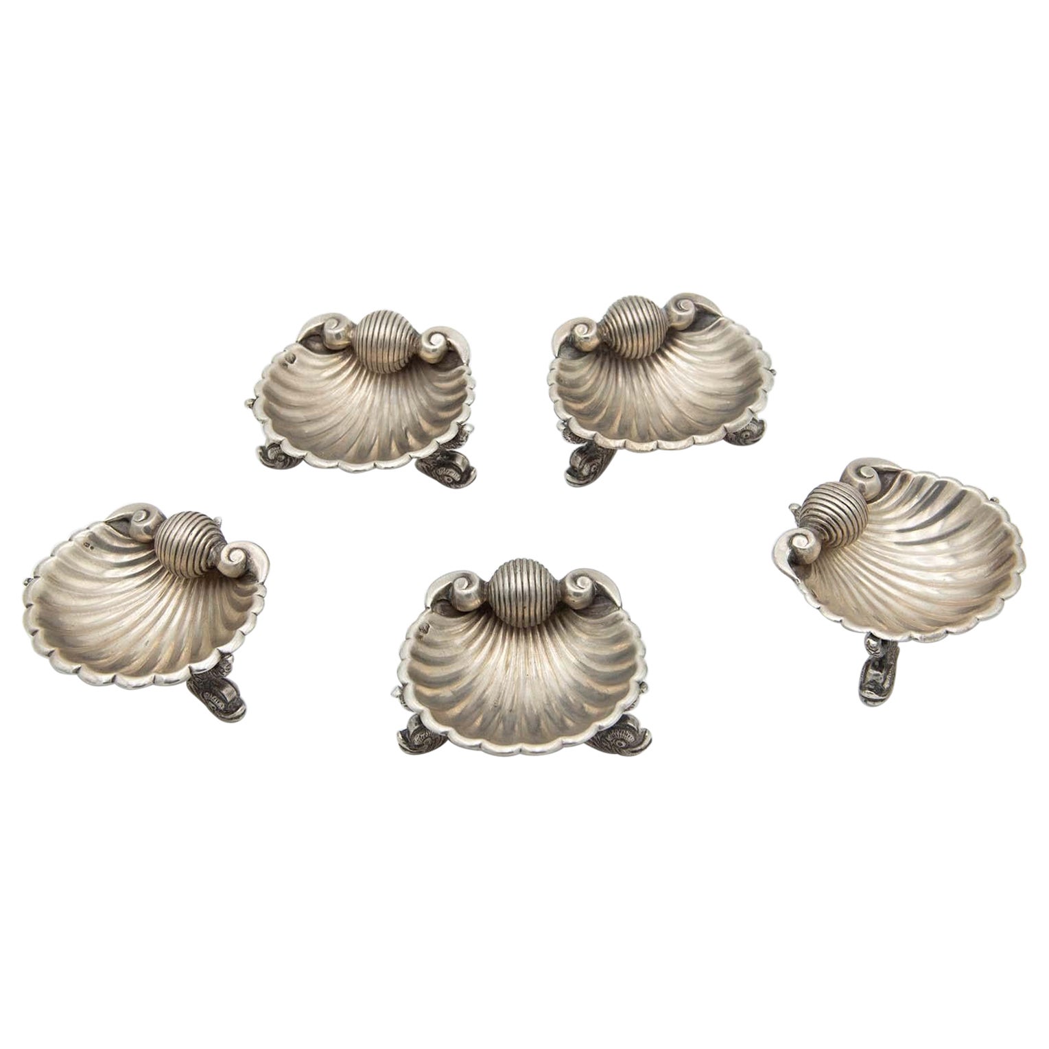 Set of five silver shell-shaped ring sets