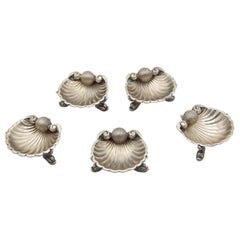 Set of five silver shell-shaped ring sets
