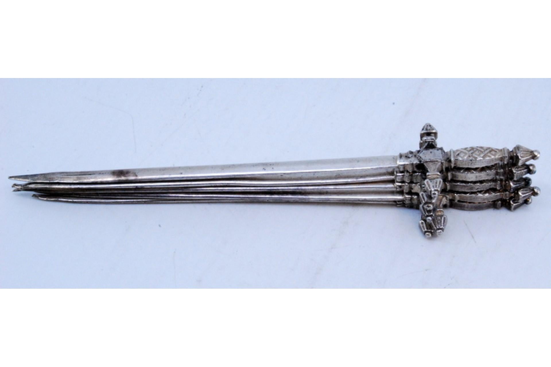 Description: Set of five silver swords with relief on the hilt. Metal: Silver. Origin: European. Brand: Absent. Weight: 95.31 grams (Set of five swords). Dimensions: 17x3.5cm. Content: 835/1000. Assay Mark: Absent. Additional information: Good