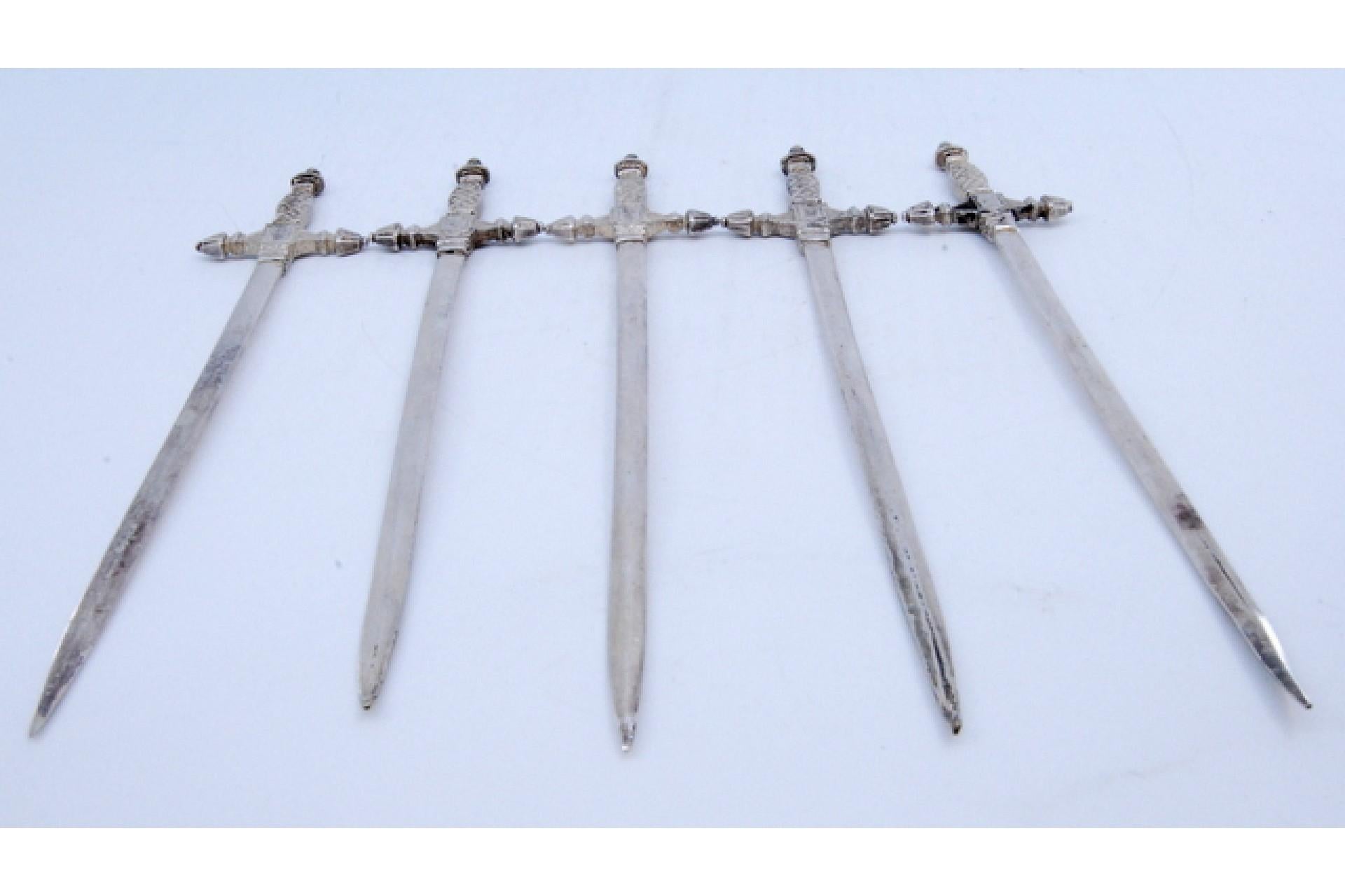 20th Century Set of five silver swords with relief on the hilt For Sale