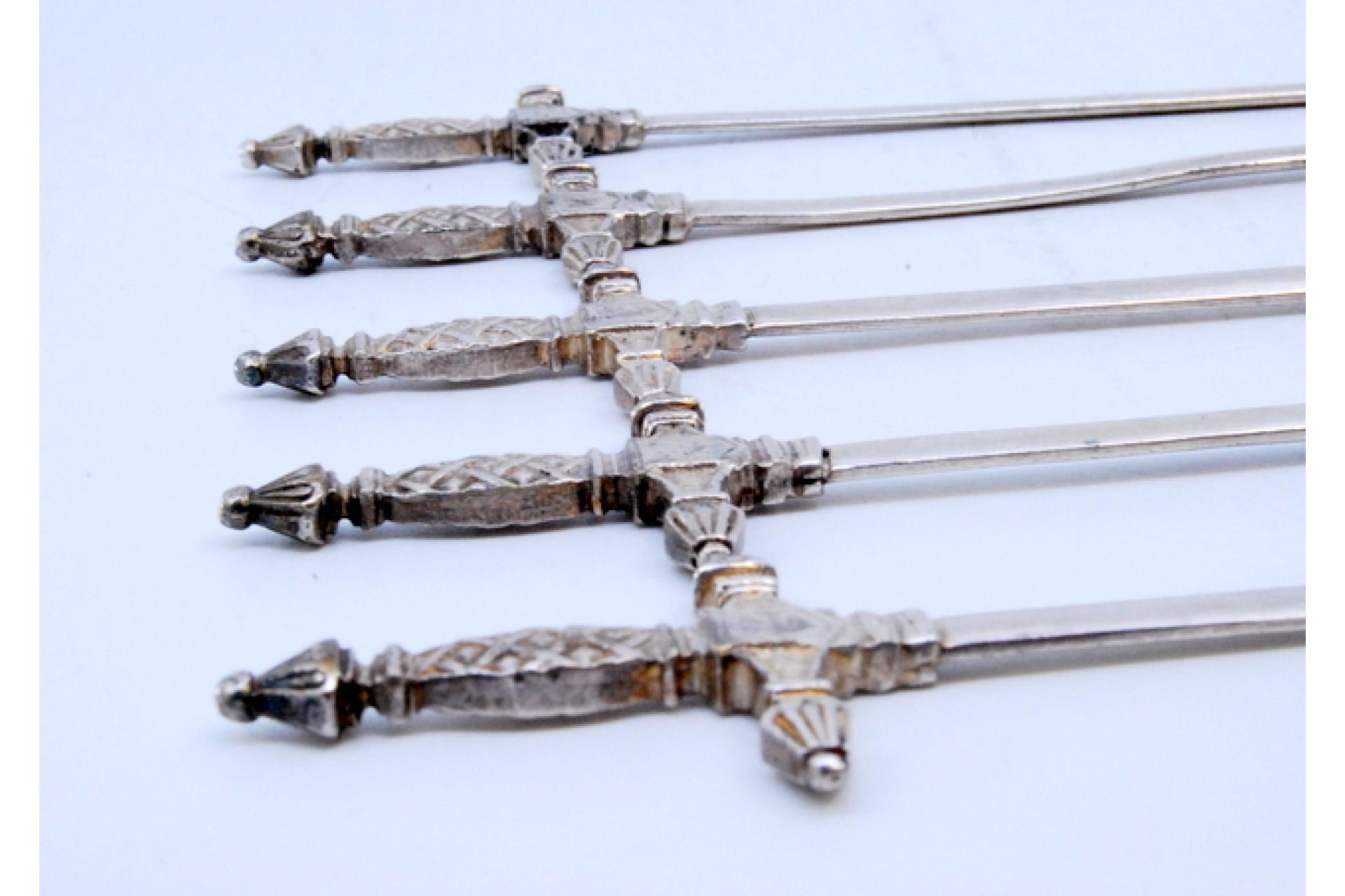 Silver Set of five silver swords with relief on the hilt For Sale