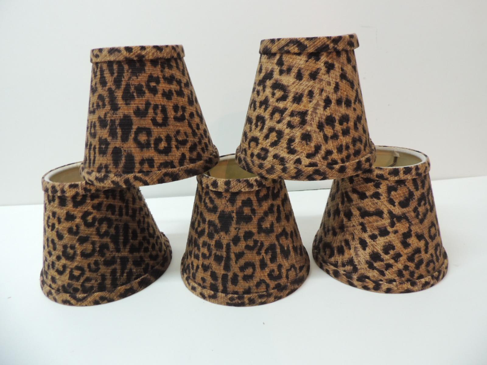 Set of five small candelabras leopards cotton fabric woven lamp shades and self welt.
Small brass clip-on shades.
Ideal for single table lamps, sconces or chandeliers.
Size: 5” W at bottom x 4.5” H x 3” top.