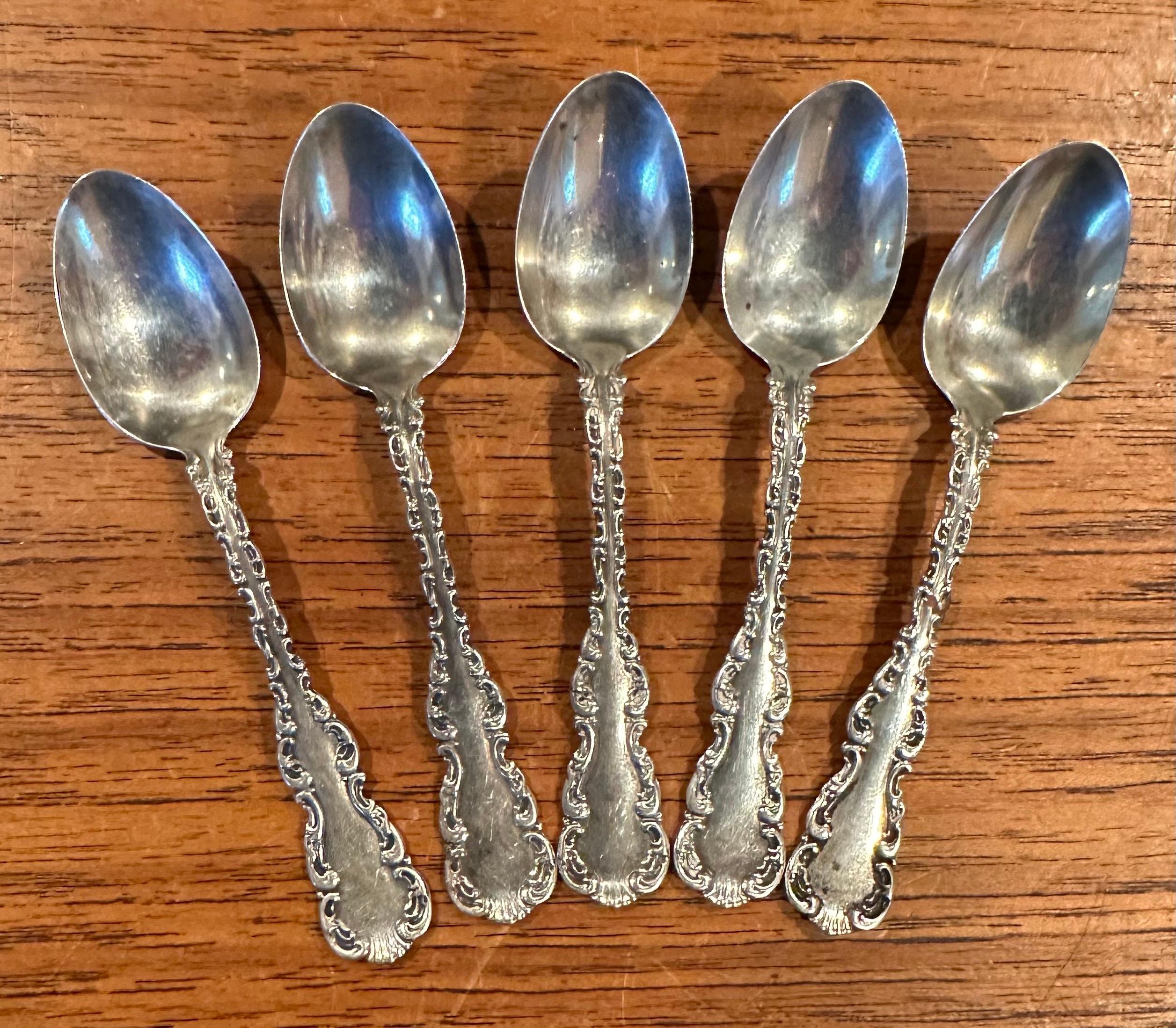 Simple and elegant set of five sterling silver demitasse spoons, circa 1940s. The set is in very good vintage condition and each spoon measures .75