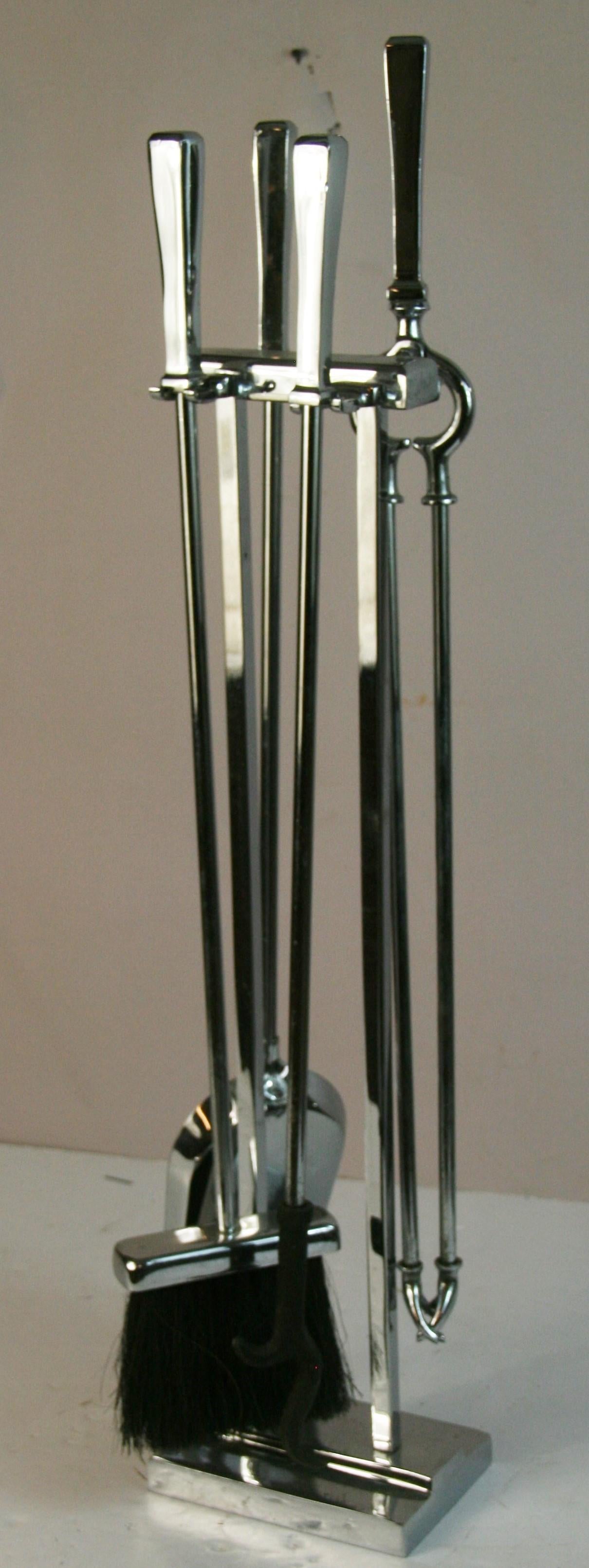 1852 A set of 5 stylish Modernist Polished nickel Fireplace  tools with a solid base stand
includes a poker, broom ,shovel and tongs and base 

Superb quality heavy and well made
Excellent vintage condition