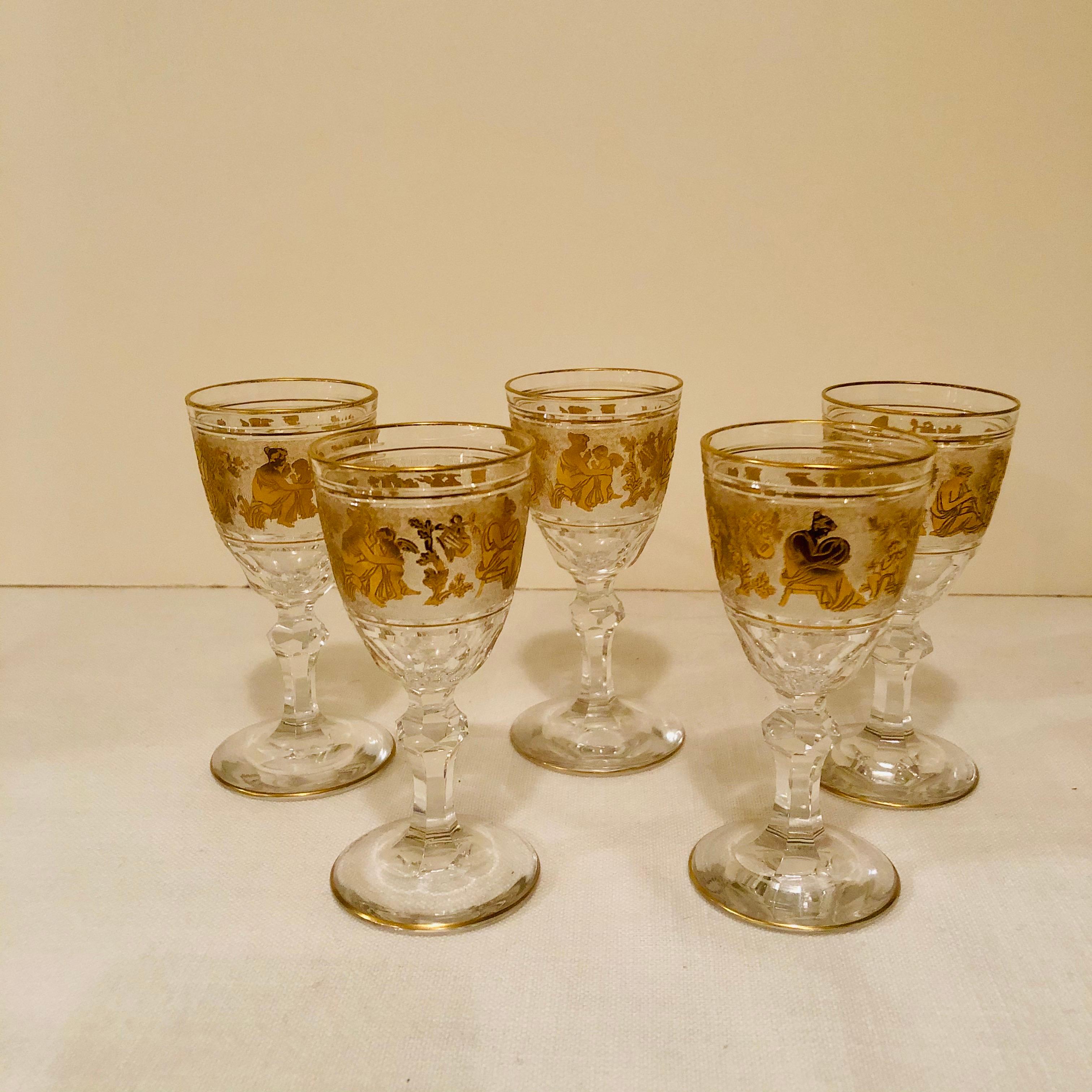 These are a set of rare hand blown Val Saint Lambert cut cameo glass sherries or ports with gold leaf decorations of a lady with a cherub, ladies and a cherub and a lady and man with a cherub. These gold leaf decorations are very detailed and