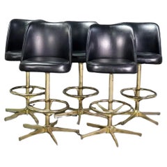 Ensemble de cinq tabourets de bar vintage