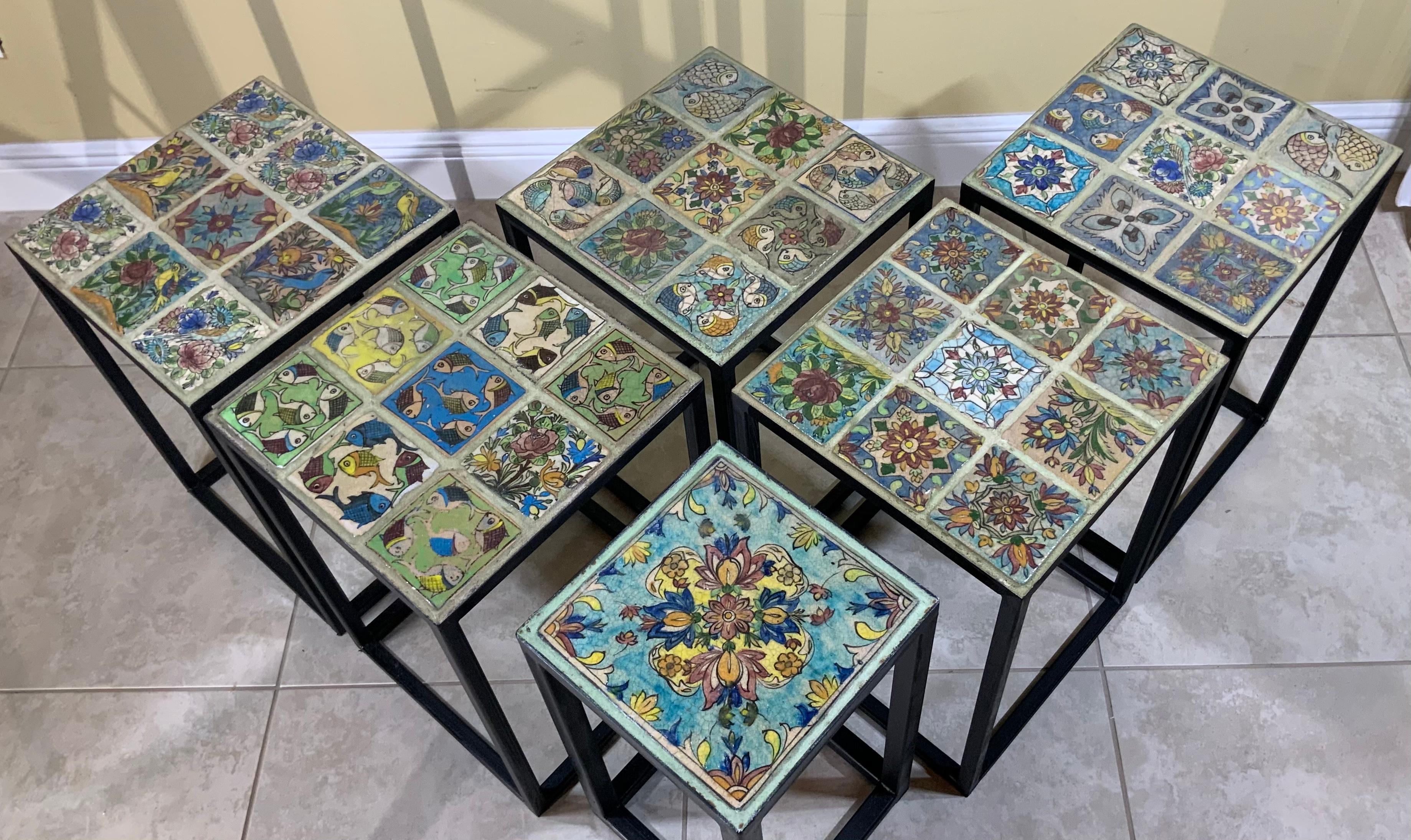 Elegant side tables made of beautiful vintage hand painted and glazed ceramic tiles, professionally mounted on steel base painted in black. Decorative functional side table, also light to move, could purchase individually upon request. Price of each