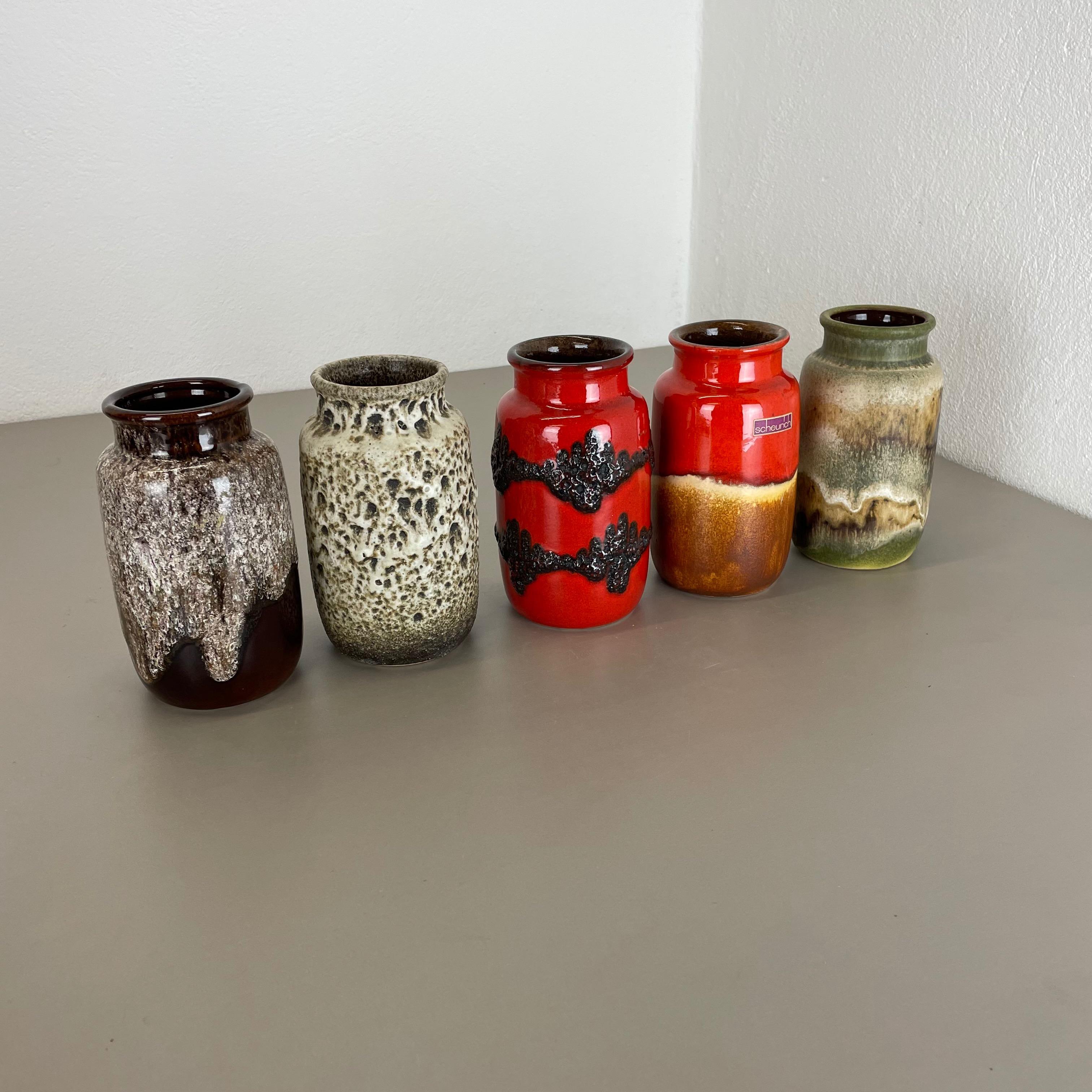 Article:

Set of five fat lava art vases

Producer:

Scheurich, Germany

Decade:

1970s

These original vintage vases was produced in the 1970s in Germany. It is made of ceramic pottery in fat lava optic. Super rare in this coloration.