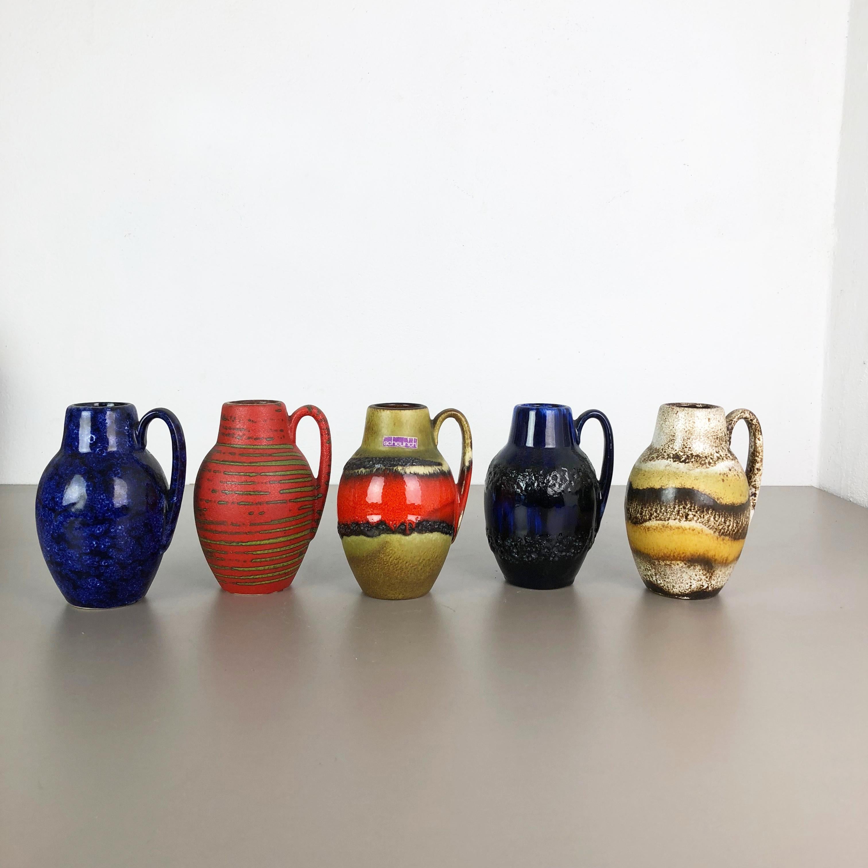 Article:

Set of five fat lava art vases


Model:

414-16

Producer:


Scheurich, Germany


Decade:

1970s

These original vintage vases was produced in the 1970s in Germany. It is made of ceramic pottery in fat lava optic. Super