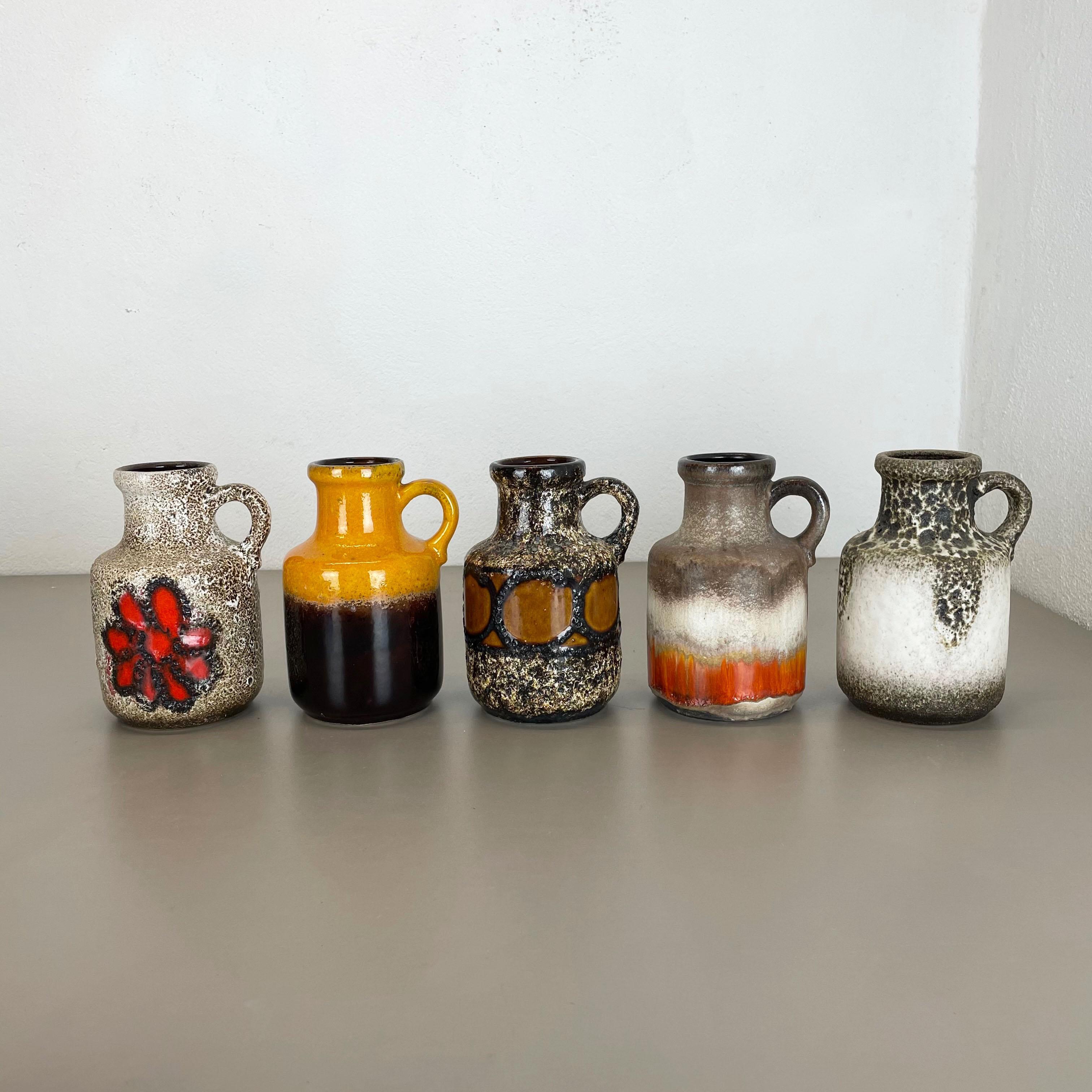Article:

Set of five fat lava art vases


Model:

414-16

Producer:


Scheurich, Germany


Decade:

1970s

These original vintage vases was produced in the 1970s in Germany. It is made of ceramic pottery in fat lava optic. Super