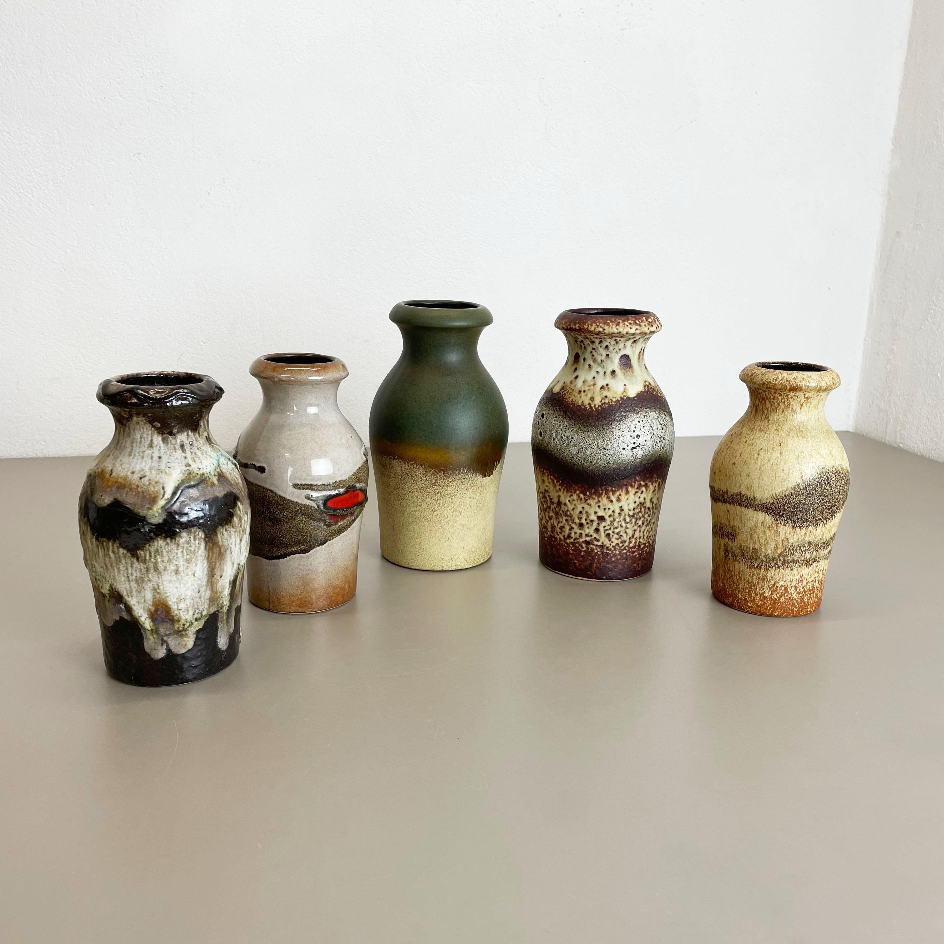 Article:

Set of five fat lava art vases


Producer:

Scheurich, Germany


Design:

Nr. 208-21
Nr. 523-18



Decade:

1970s


This original vintage vase set was produced in the 1970s in Germany. It is made of ceramic in fat
