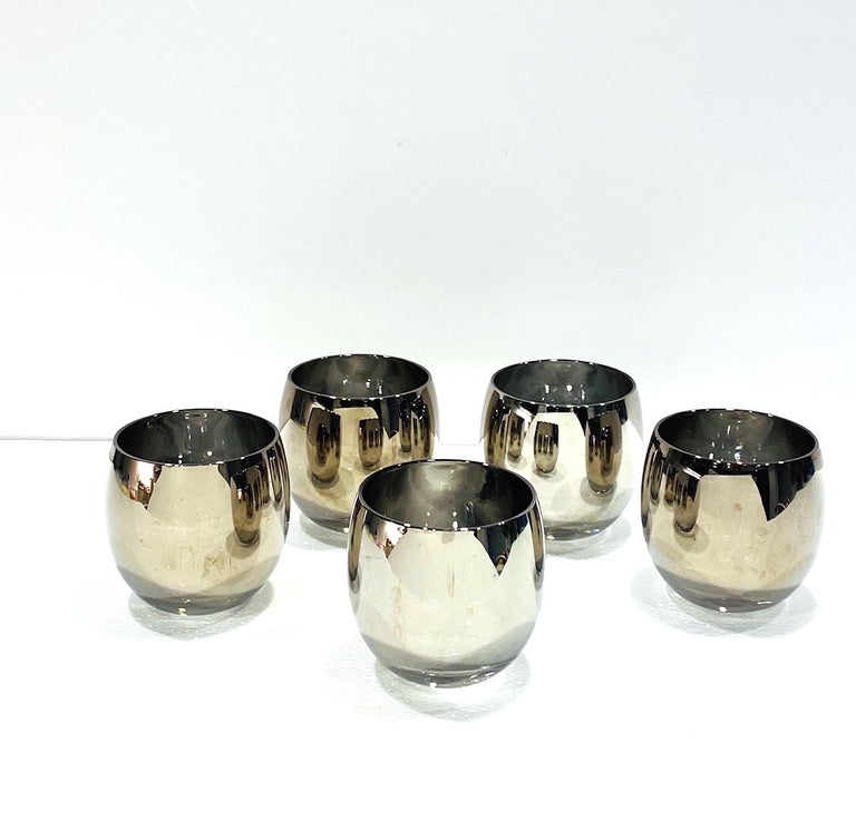 Iconic Mid-Century Modern barware glasses with silver overlay design. Great looking large rock glasses often referred to as roly-poly glasses because of their round forms. The glasses are almost all silvered, with a slight gradient ombre gunmetal