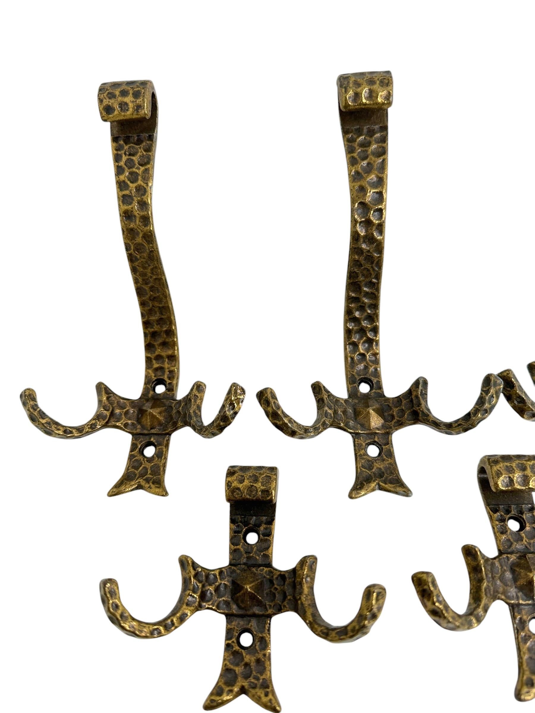 A set of five wall hooks, made in the 1960s. They are made of metal in the Brutalist Style. Wear of use, lovely patina, some use-lanes but this is old-age. Found at an Estate Sale in Utrecht, Netherlands. A nice addition for your entry hall or any