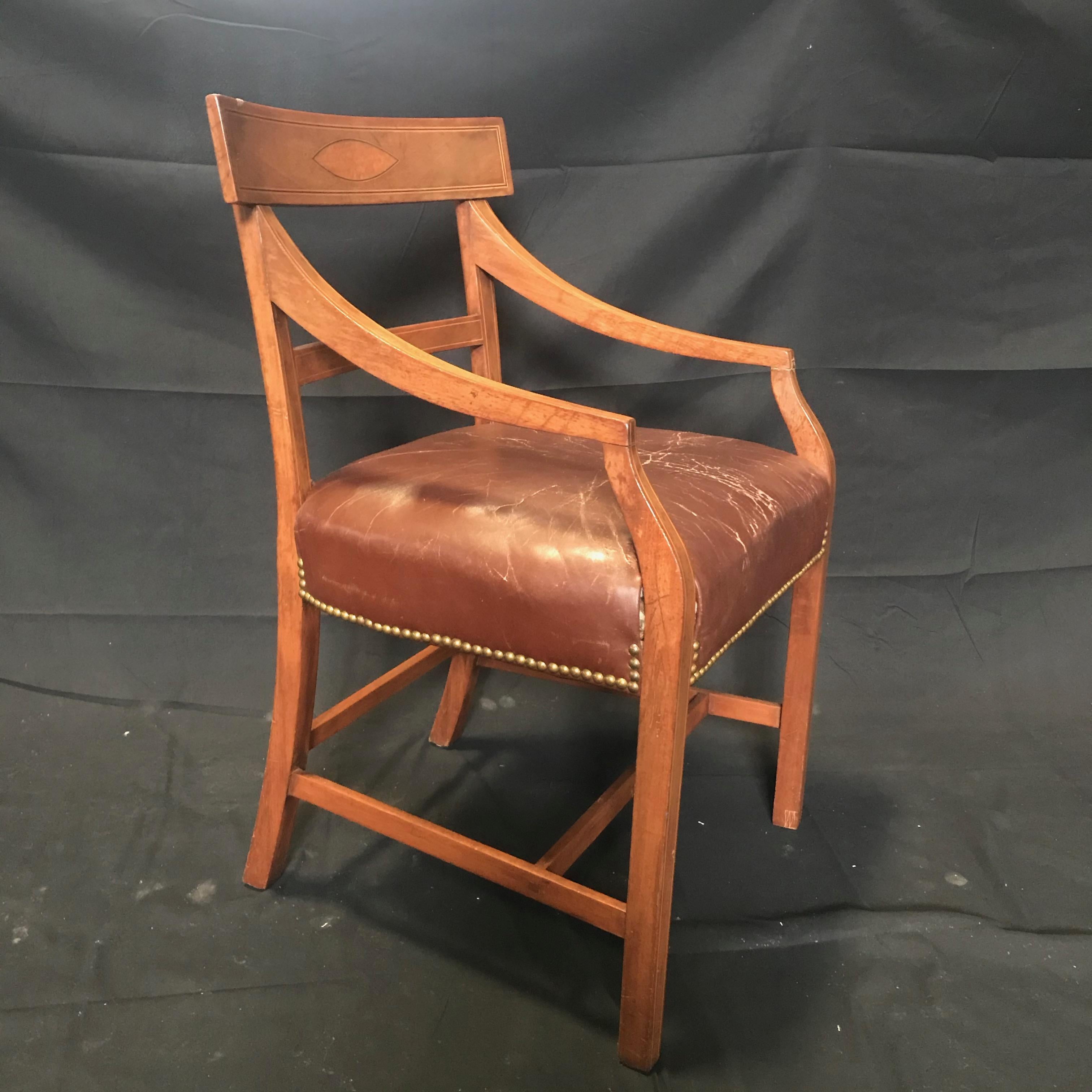 Set of five walnut Regency dining chairs with inlaid diamond backs and distressed burgundy leather seats including 1 armchair and 4 sides. A few seats have a very small tear (see photos) but overall in good shape; great early worn leather