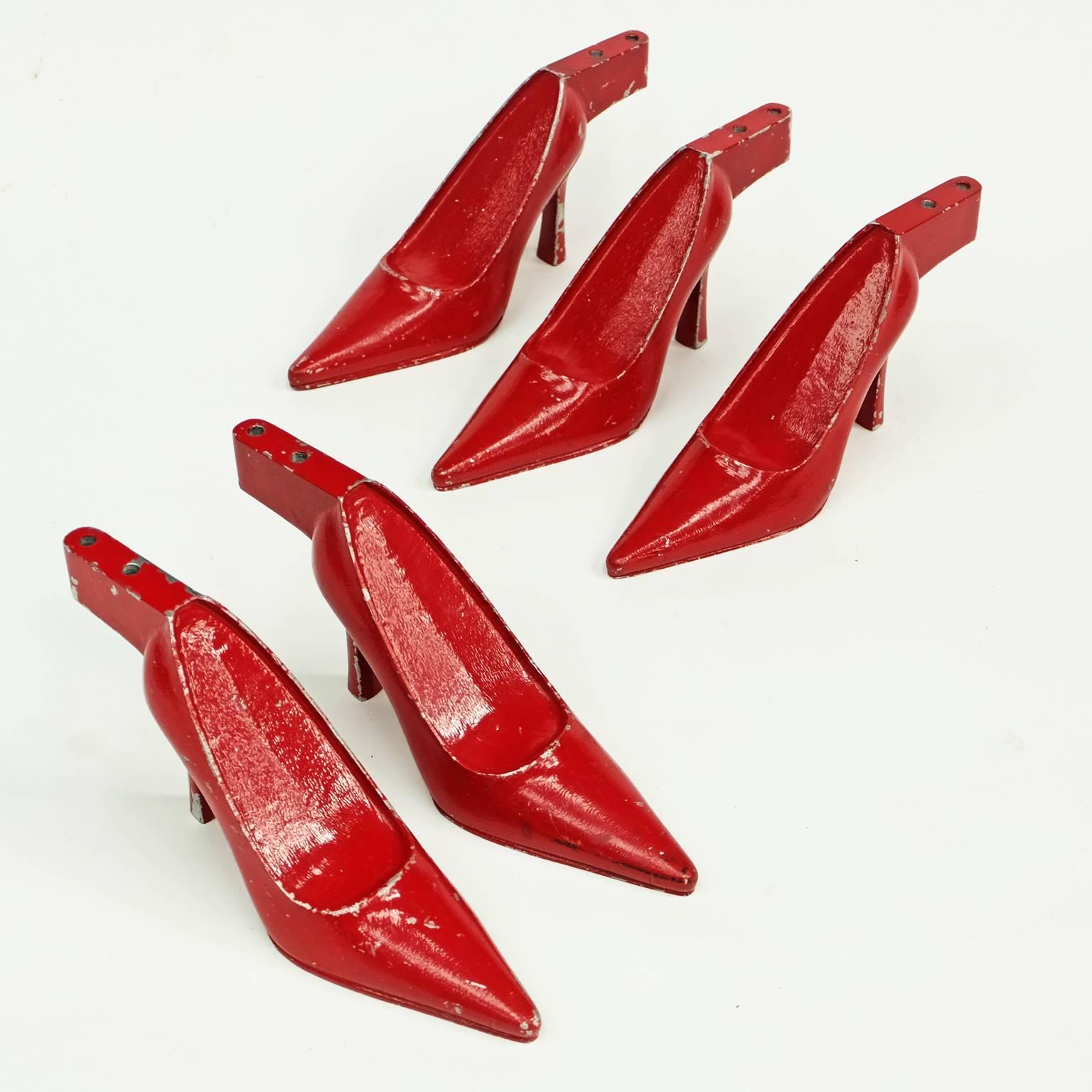 Set of five x 1950s Stiletto shoe displays. Red painted steel form designed and manufactured in the United Kingdom.

The shoes can be displayed as a group or individually. 

Signs of original age to the red painted surface.
Each shoe weighs an