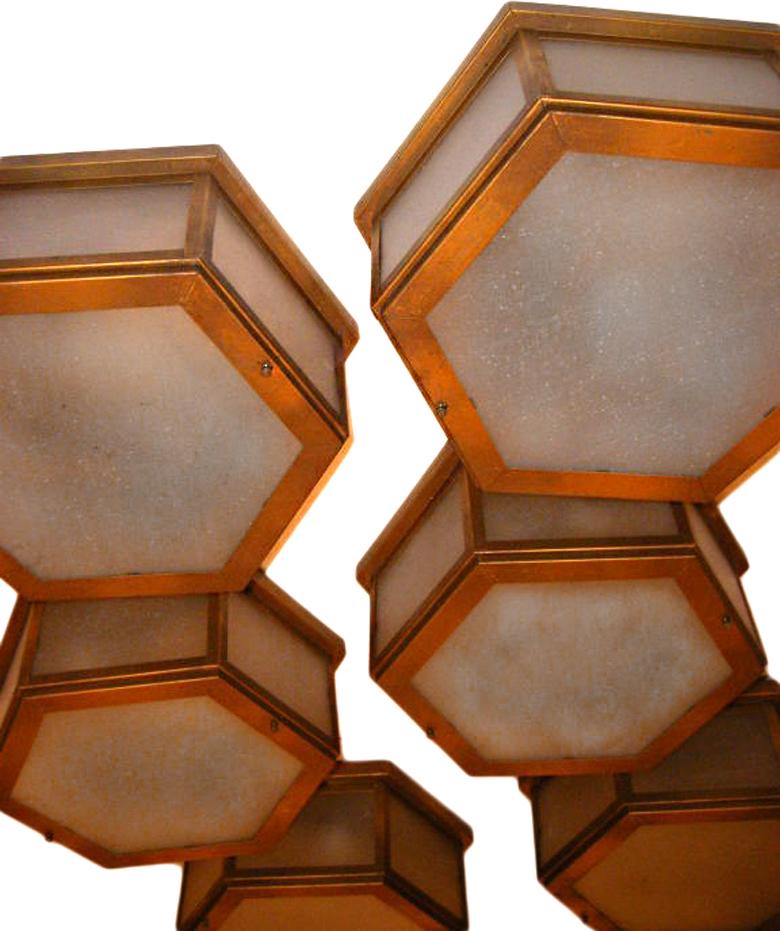 Set of sixteen circa 1940’s hexagonal Italian flush mounted bronze and frosted glass light fixtures. Sold individually.

Measurements:
Diameter: 15″
Drop: 6″