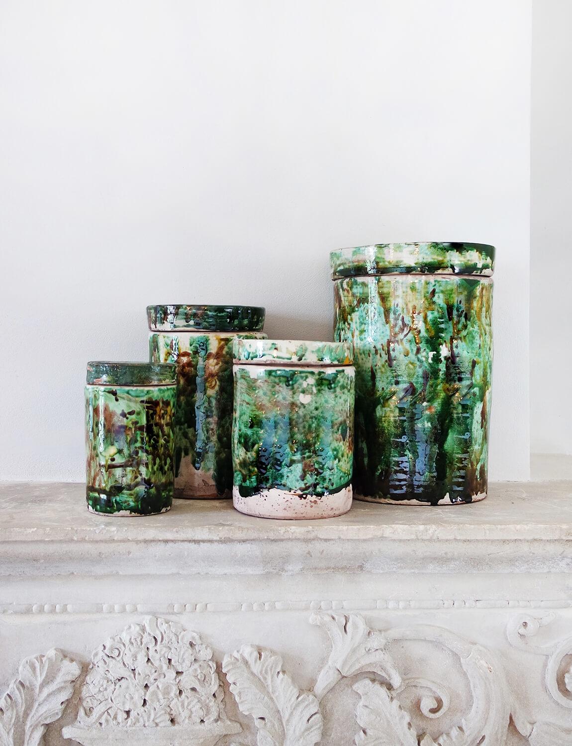 Found in Southern Italy, these exquisite and unusual green pots made in the mid 20th century were originally used to preserve dried figs. More commonly seen in a cream ceramic, these particular pieces are an extraordinary green colour due to their