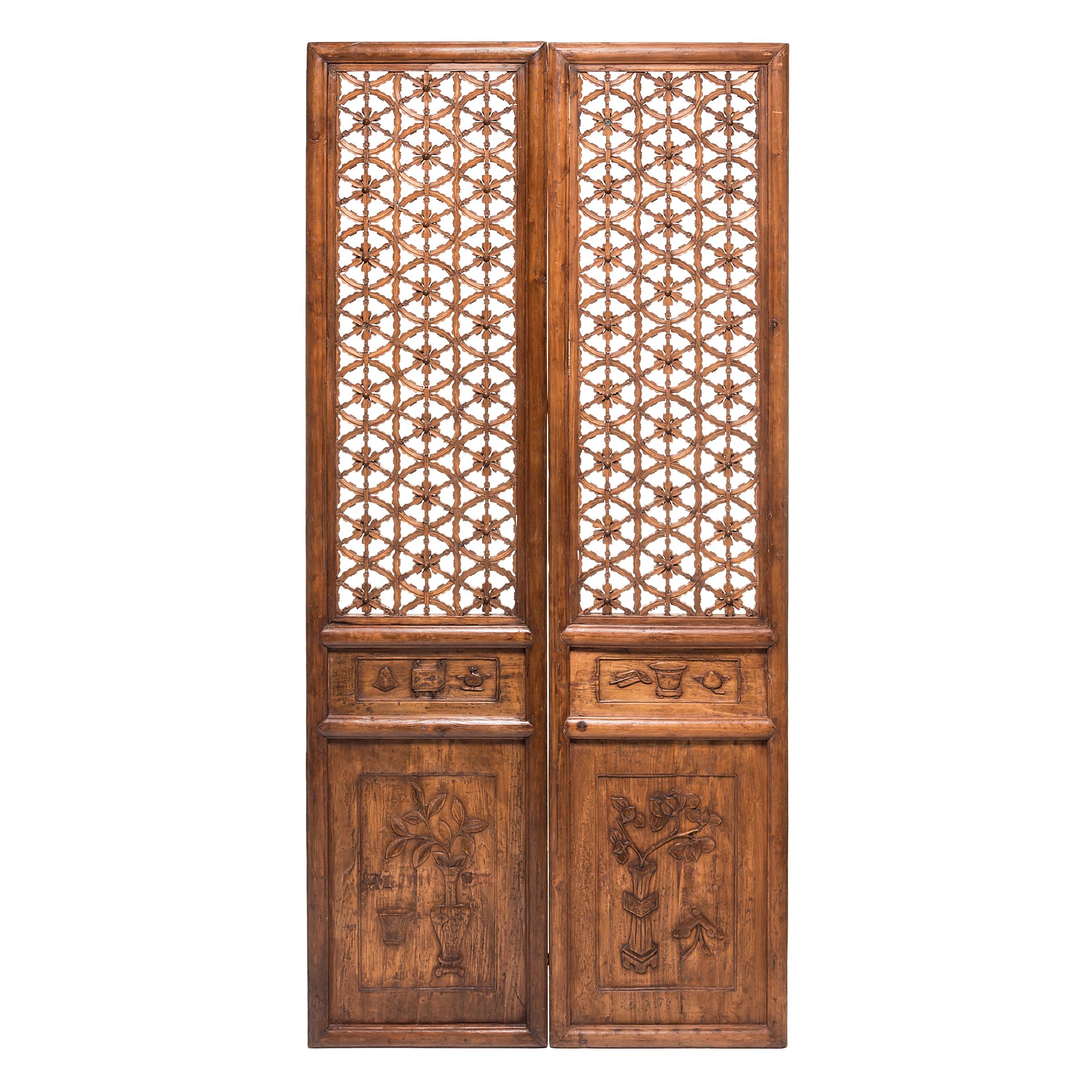 The sweeping elegance of these four 18th century courtyard doors, with their intricate lattice panels, hides the mathematical brilliance required to create them. The panels recall life in a traditional courtyard home, where the openwork lattice
