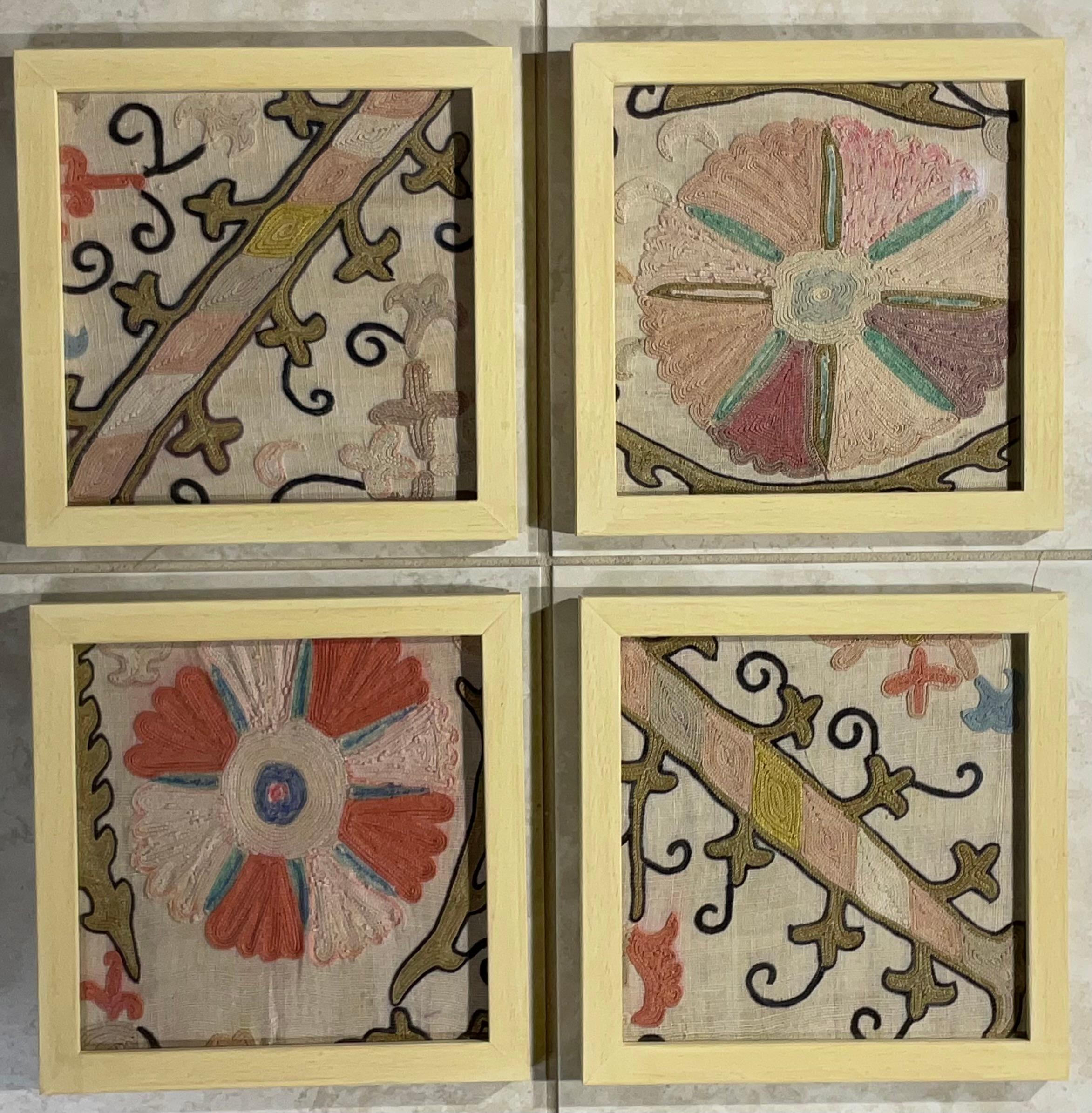 
This beautiful set of four Suzani embroidery features intricate geometric and floral patterns, showcasing traditional Uzbek craftsmanship. The vibrant colors and tight stitching suggest good quality. The hand-painted solid wood frame complements
