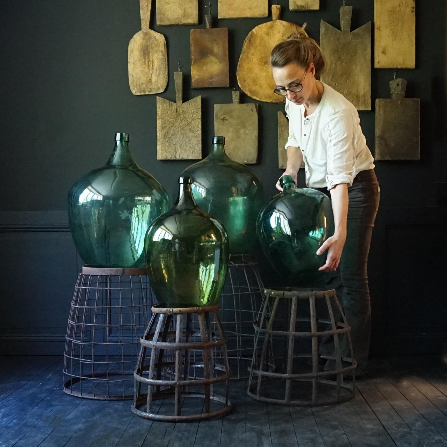 Hand-Crafted Set of Four 1920s French Green Demijohns, Lady Jeanne or Carboys in Metal Basket
