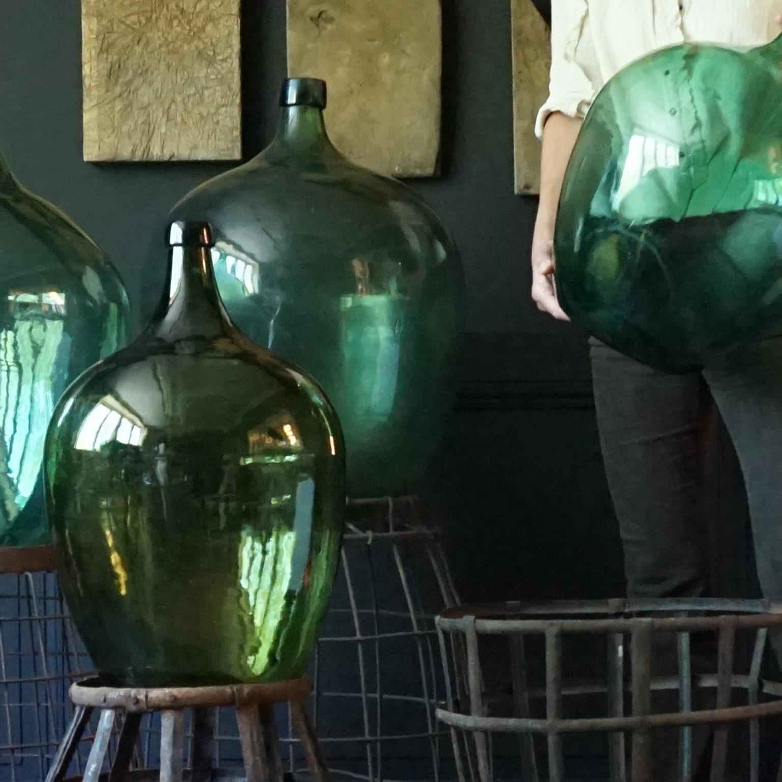 Set of Four 1920s French Green Demijohns, Lady Jeanne or Carboys in Metal Basket In Good Condition In Haarlem, NL