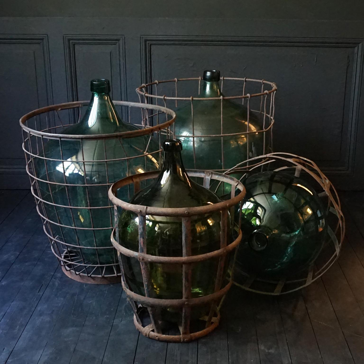 Set of Four 1920s French Green Demijohns, Lady Jeanne or Carboys in Metal Basket 1