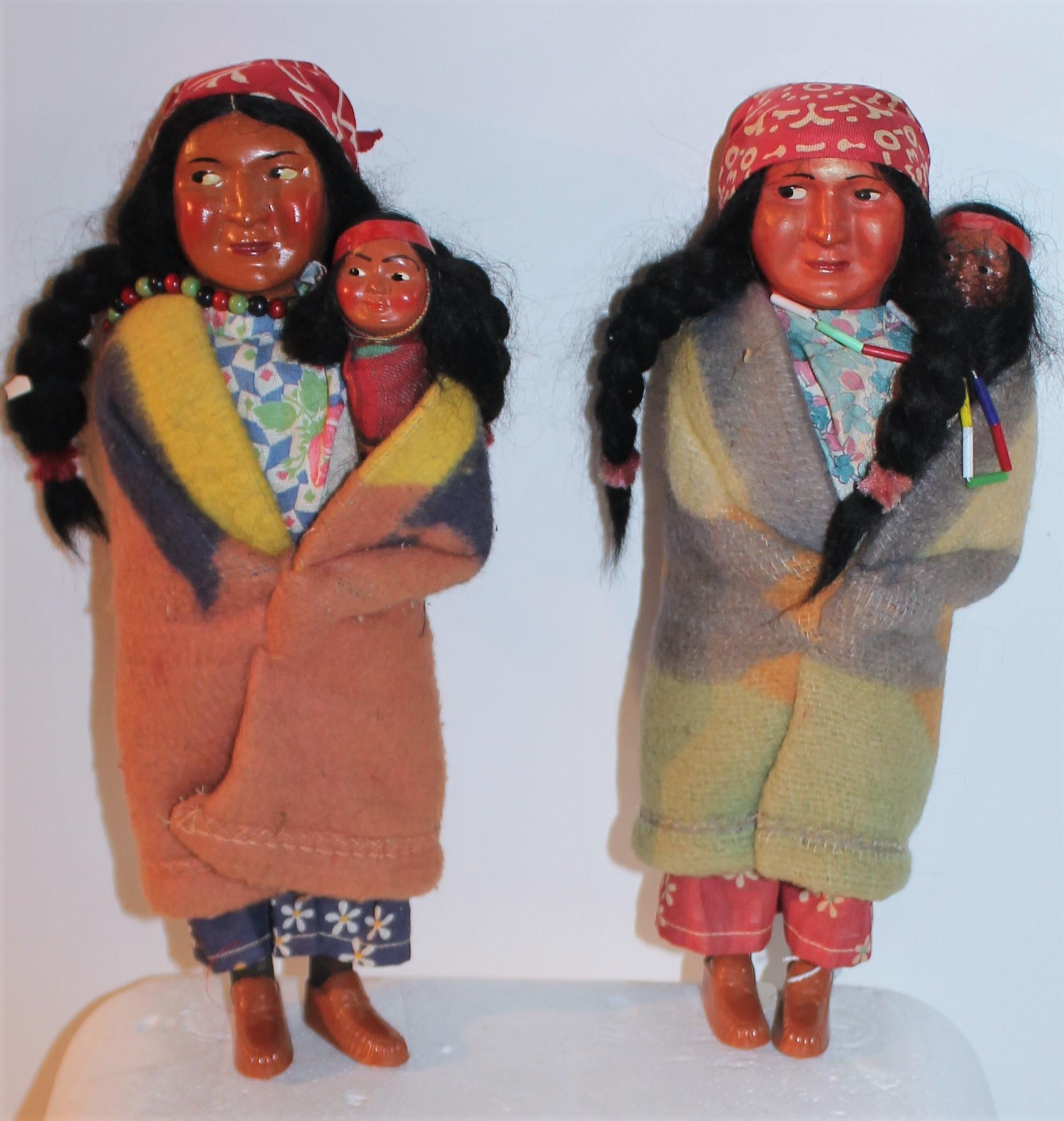 Set of four 1930's skookum mother and Papoose dolls. Each doll has real hair and is wearing a Indian design Beacon Blanket.
Largest Measures - 10.5 tall x 4 wide 
Smallest measures - 10.5tall x 3.75 wide.
 