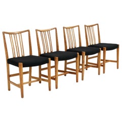 Set of Four 1940s Hans Wegner Oak Dining Chairs with Carved Floral Pattern