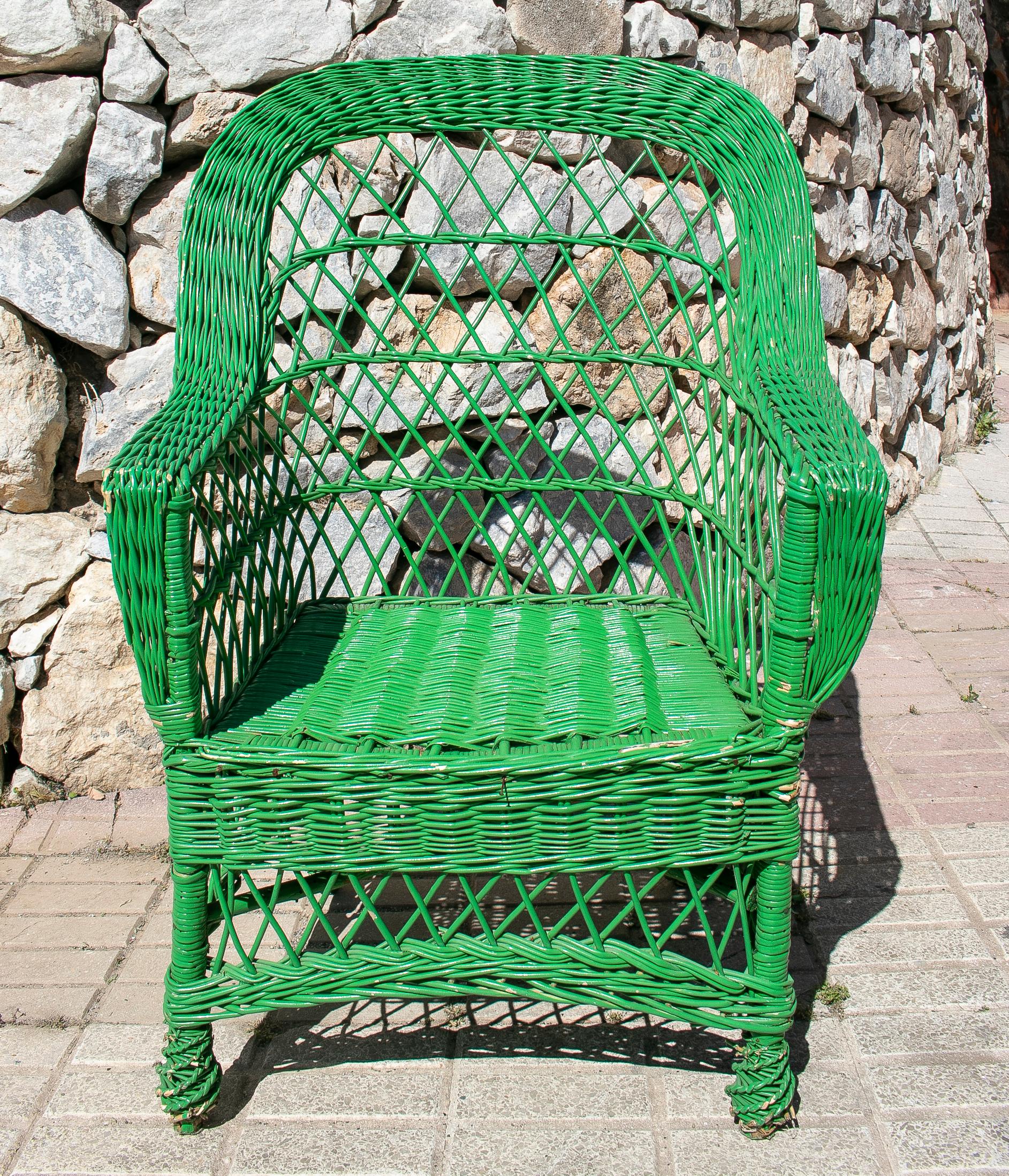 Set of four vintage 1950s Spanish green lace wicker armchairs.